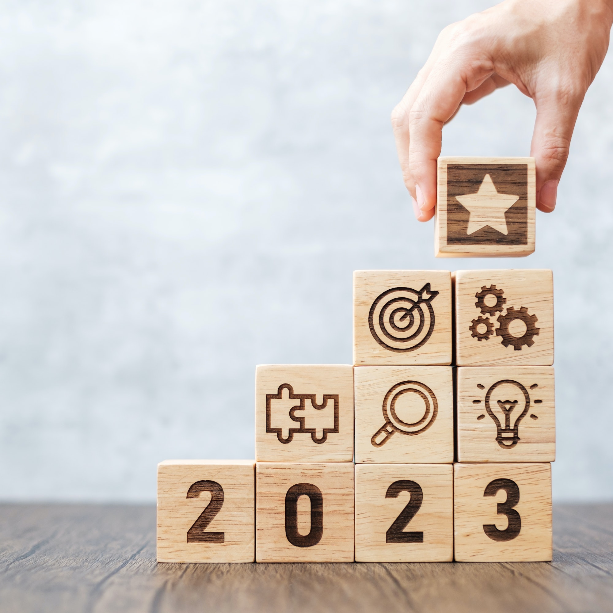 2023 wood block with business success, mission, teamwork, plan, idea and New Year start concept