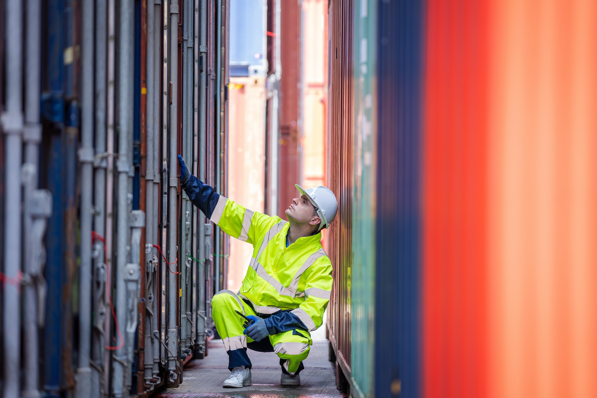 Engineer working in shipping container in Container Terminal.